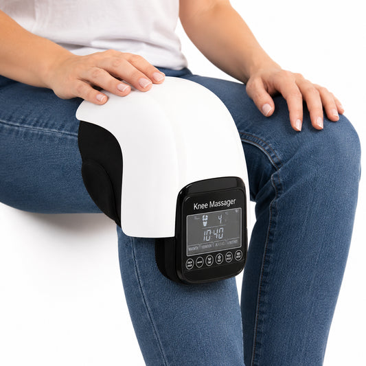 Knämassage med värme och vibration som används sittande för stöd och avslappning av knäleden.